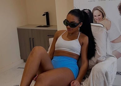 Woman in treatment chair at Laser Lounge, Ramsbottom, England, GB, showcasing modern wellness setting.