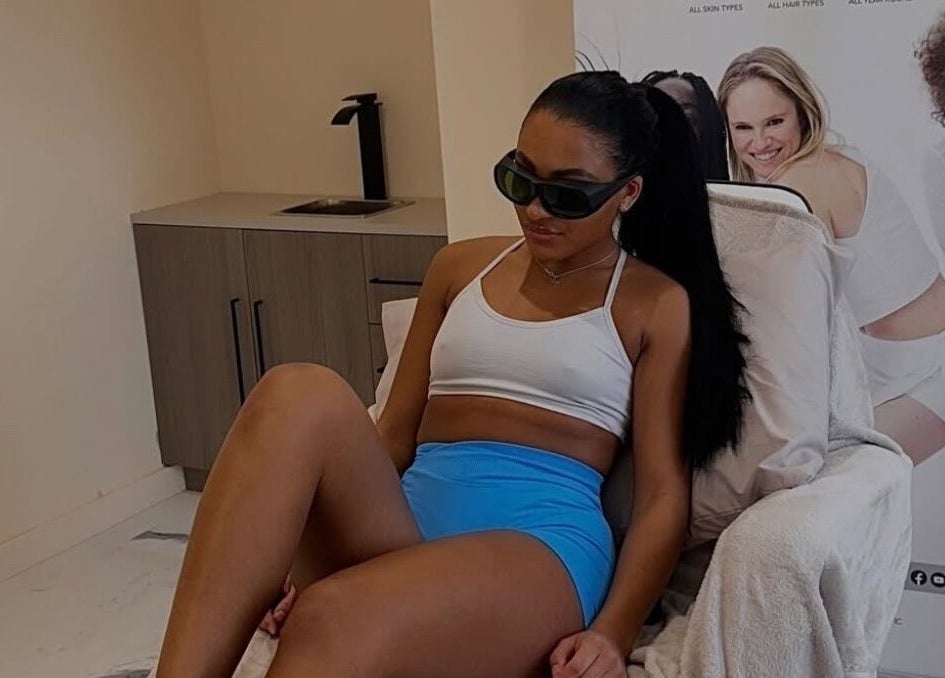 Woman in treatment chair at Laser Lounge, Ramsbottom, England, GB, showcasing modern wellness setting.