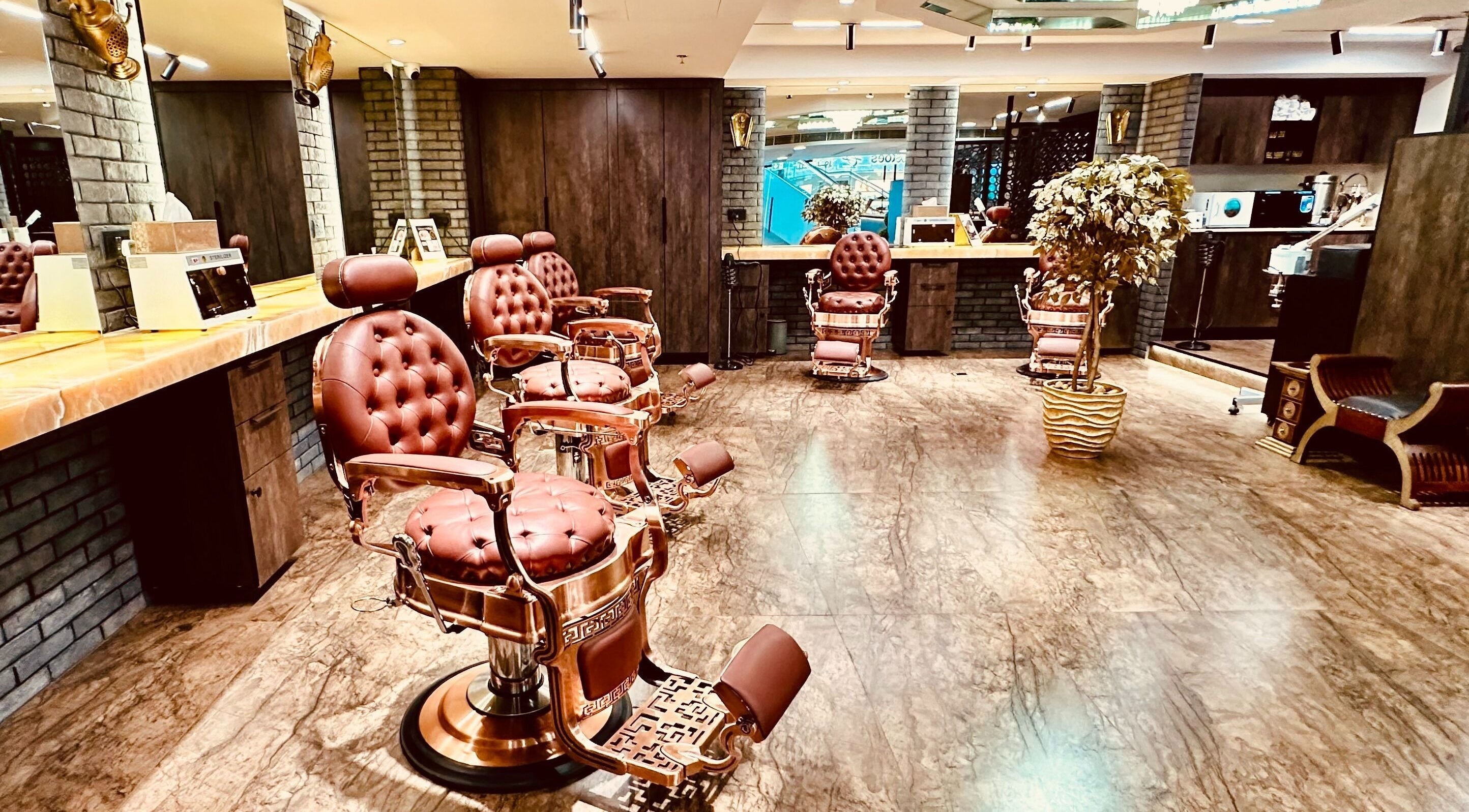 Elegant interior of Head Barbers 1945 in Abu Dhabi, featuring vintage chairs and a warm ambiance.