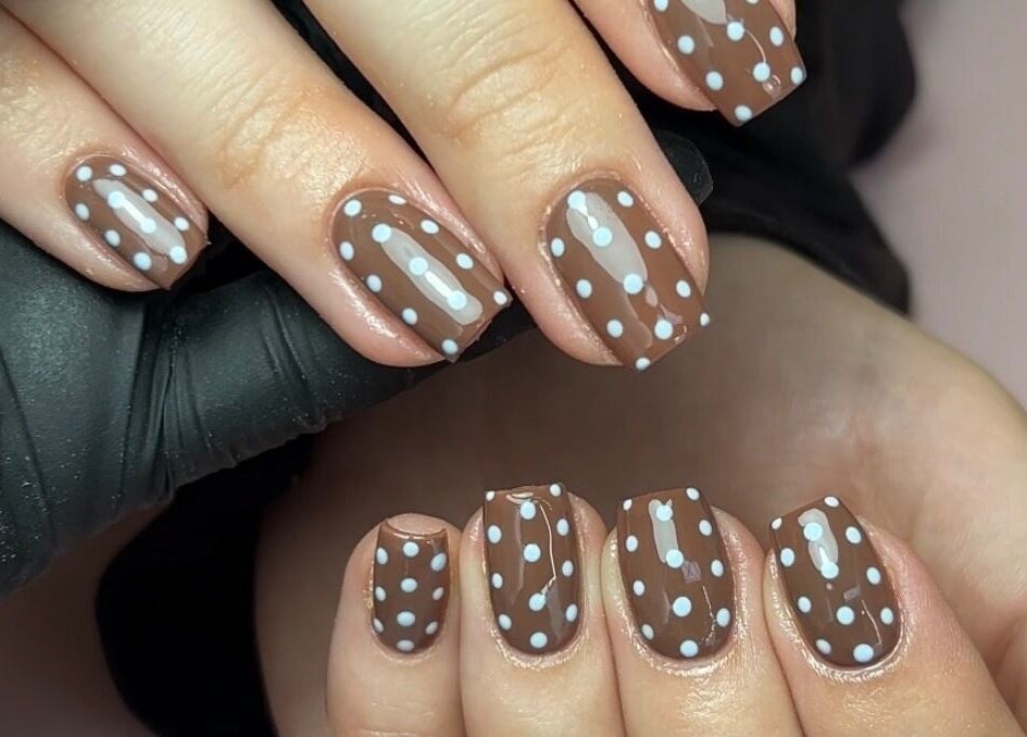 Brown nails with white polka dots by Nails by Chloe, Harrogate, England, GB.