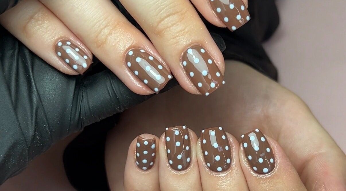 Brown nails with white polka dots by Nails by Chloe, Harrogate, England, GB.