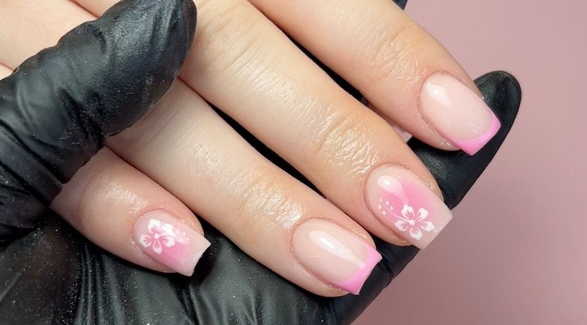 Elegant pink floral nail art at Nails by Chloe, Harrogate, England, GB, showcasing creativity and style.