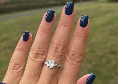 Elegant navy manicure with ring by Nails by Chloe in Harrogate, England, GB.