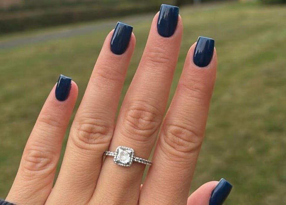 Elegant navy manicure with ring by Nails by Chloe in Harrogate, England, GB.