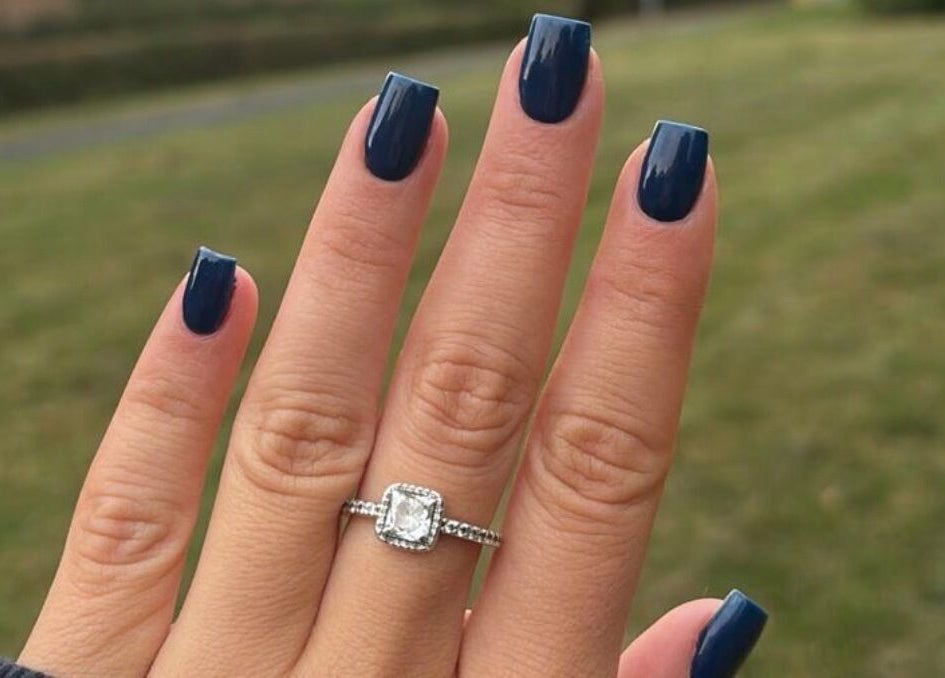 Elegant navy manicure with ring by Nails by Chloe in Harrogate, England, GB.