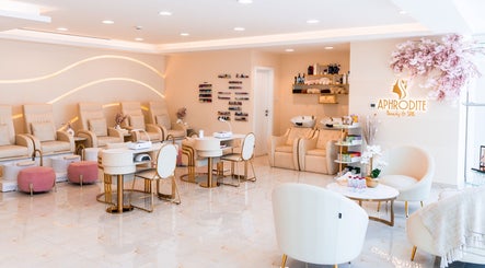 Luxurious interior of Aphrodite Beauty & Spa, Abu Dhabi, showing plush seating and elegant decor.