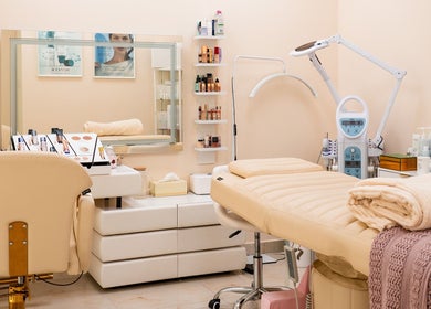 Elegant spa room with treatment bed at Aphrodite Beauty & Spa, Abu Dhabi, Abu Dhabi, AE, showcasing luxury and comfort.