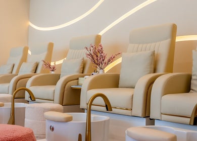 Luxurious pedicure chairs at Aphrodite Beauty & Spa in Abu Dhabi, AE offering a serene wellness experience.