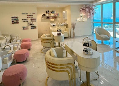 Luxurious interior of Aphrodite Beauty & Spa, Abu Dhabi showcasing manicure and pedicure stations.