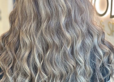 Luxurious wavy hair at Aphrodite Beauty & Spa, Abu Dhabi, AE. Stunning salon styling for elegant looks.