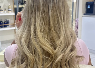 Blonde hair with elegant waves styled at Aphrodite Beauty & Spa, Abu Dhabi, Abu Dhabi, AE.