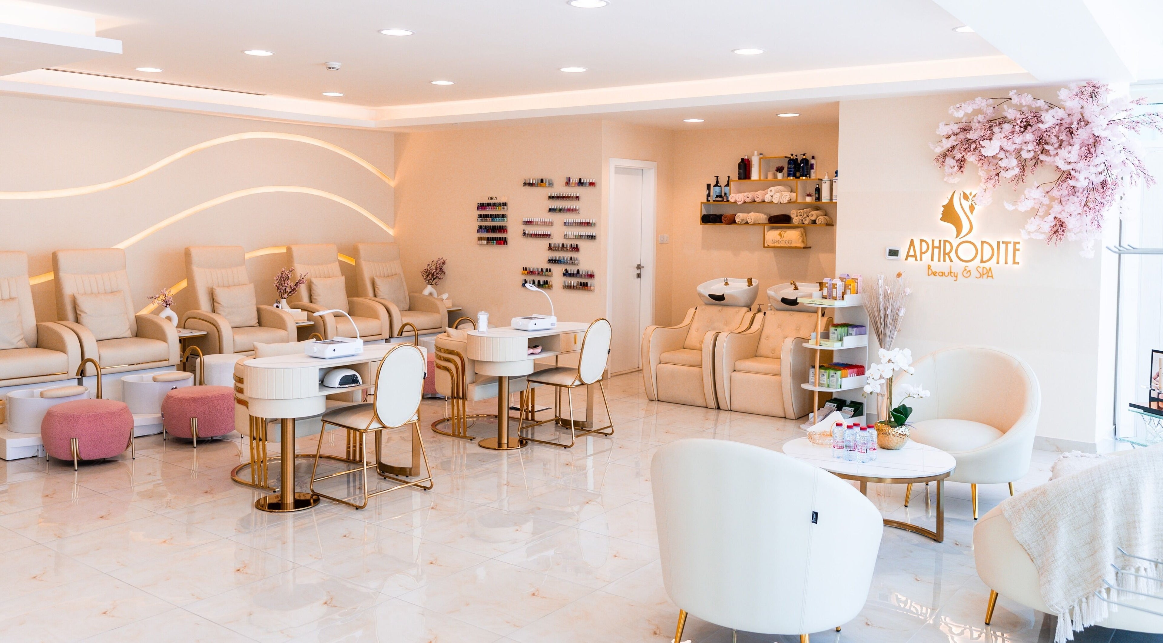 Luxurious interior of Aphrodite Beauty & Spa in Abu Dhabi, showcasing modern seating and chic decor.
