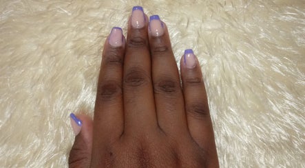 Purple French manicure at Fielda Beauty Elegant Salon in Bridgetown, Saint Michael, BB on plush background.