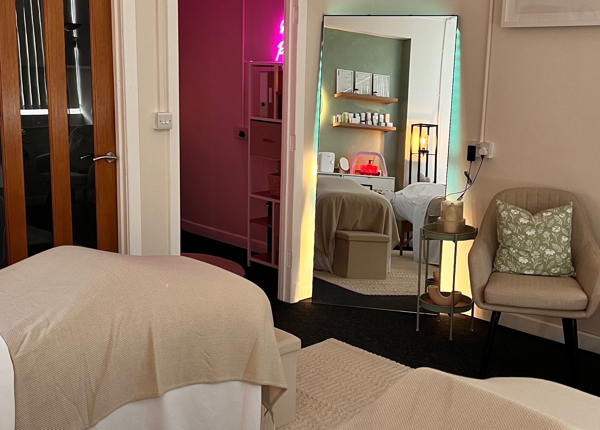 Cozy interior of Misskin & Laser Studio, Birmingham, England, GB. Inviting spa room with massage tables.