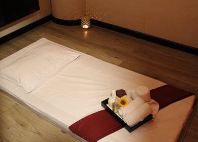 Relaxing massage setup at Feet Lounge Reflexology & Spa - Bay Avenue Mall, دبي, دبي, AE, with soft lighting.