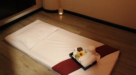 Relaxing massage setup at Feet Lounge Reflexology & Spa - Bay Avenue Mall, دبي, دبي, AE, with soft lighting.