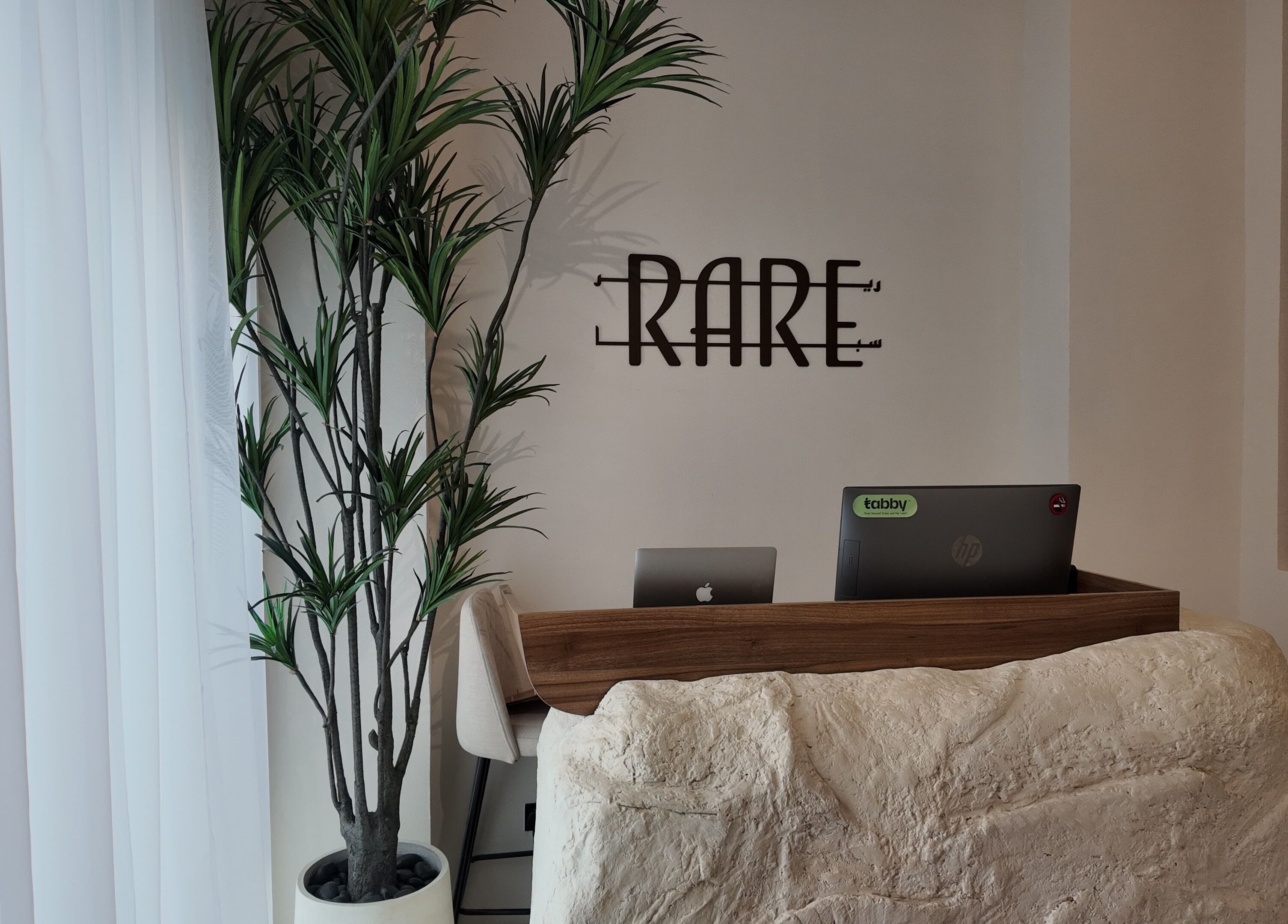 Reception area at Rare Spa, Sharjah, AE with sleek decor and welcoming ambiance.