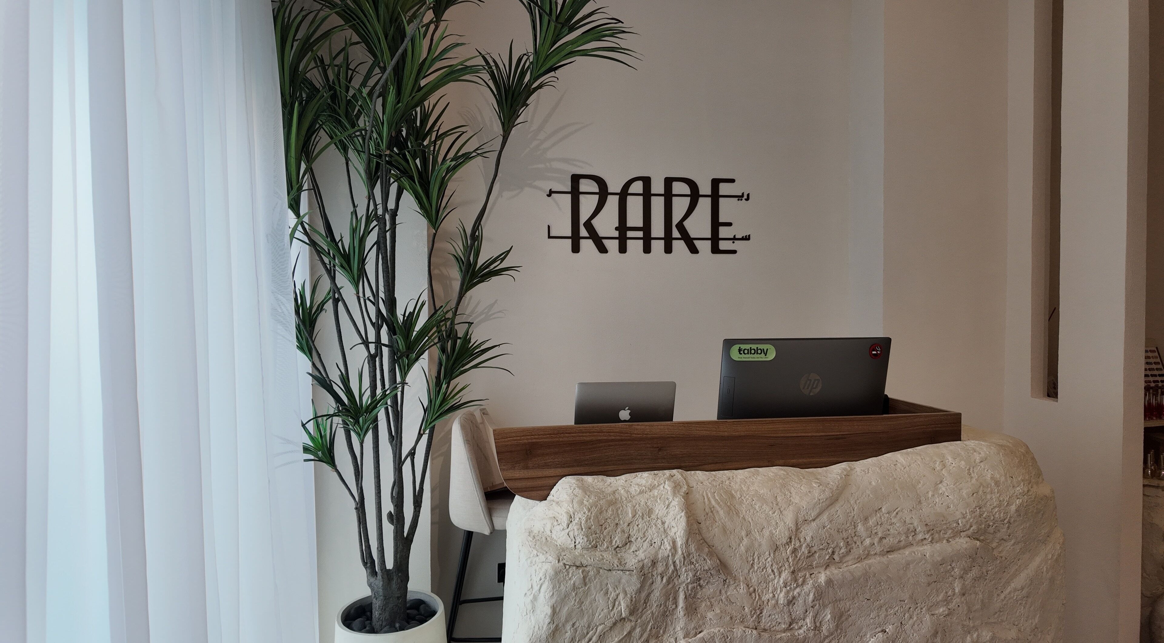 Reception area at Rare Spa, Sharjah, AE with sleek decor and welcoming ambiance.