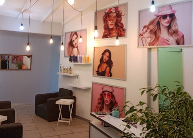 Interior of Tylaz Hair Studio in Randburg, Gauteng, ZA, showcasing modern decor and vibrant photo walls.