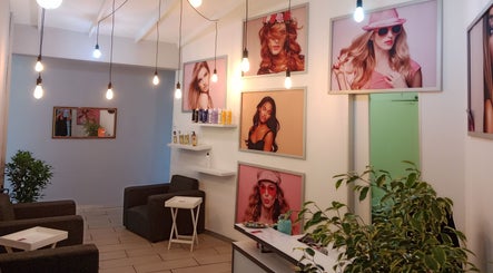 Interior of Tylaz Hair Studio in Randburg, Gauteng, ZA, showcasing modern decor and vibrant photo walls.
