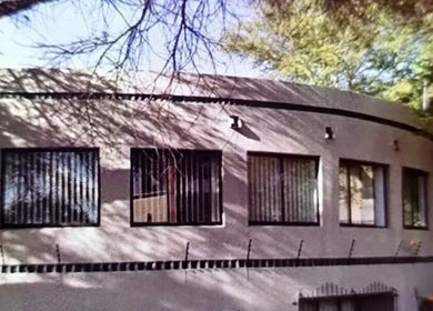 Exterior of Tylaz Hair Studio, Randburg, Gauteng, ZA, showing a serene and inviting curved building facade.