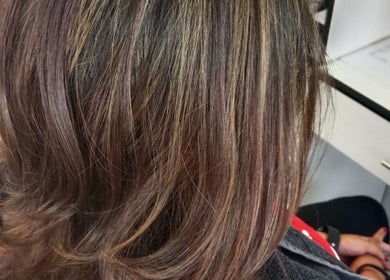 Smooth, highlighted brown hair styled at Tylaz Hair Studio in Randburg, Gauteng, ZA.