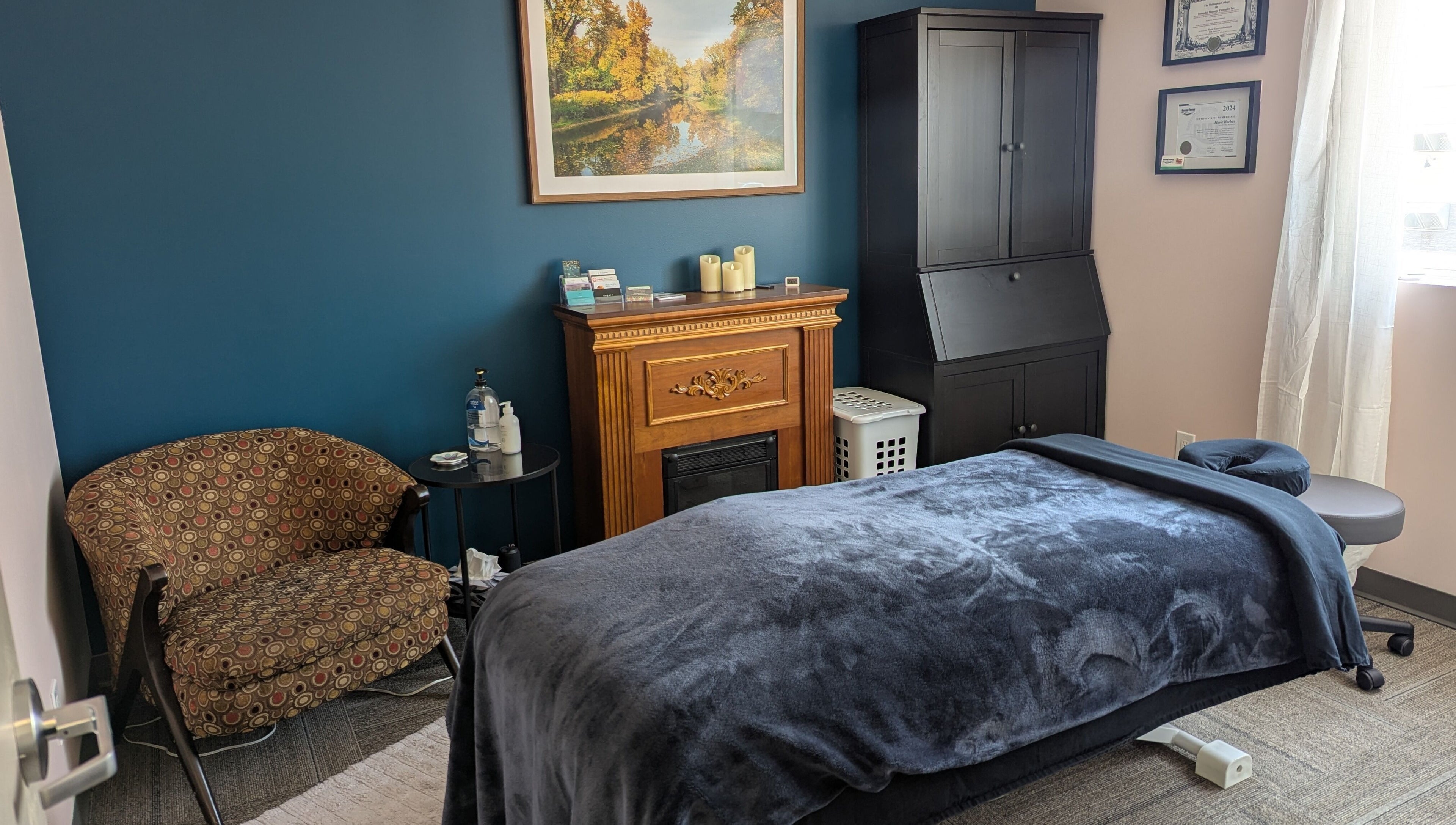 Elegant massage room at Marie Horbas RMT in West Saint Paul, Manitoba, CA with plush bed and decor.