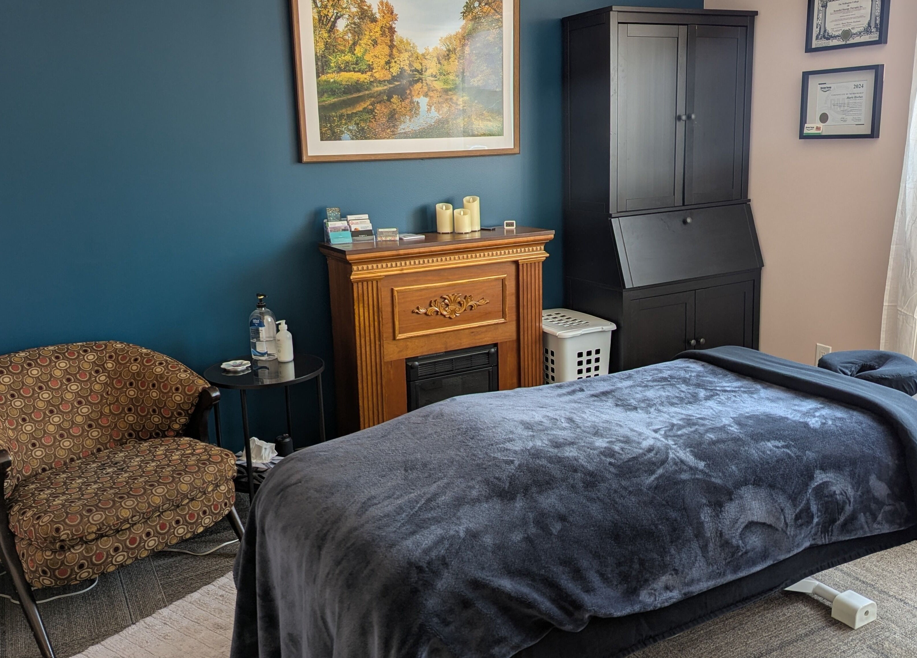 Elegant massage room at Marie Horbas RMT in West Saint Paul, Manitoba, CA with plush bed and decor.