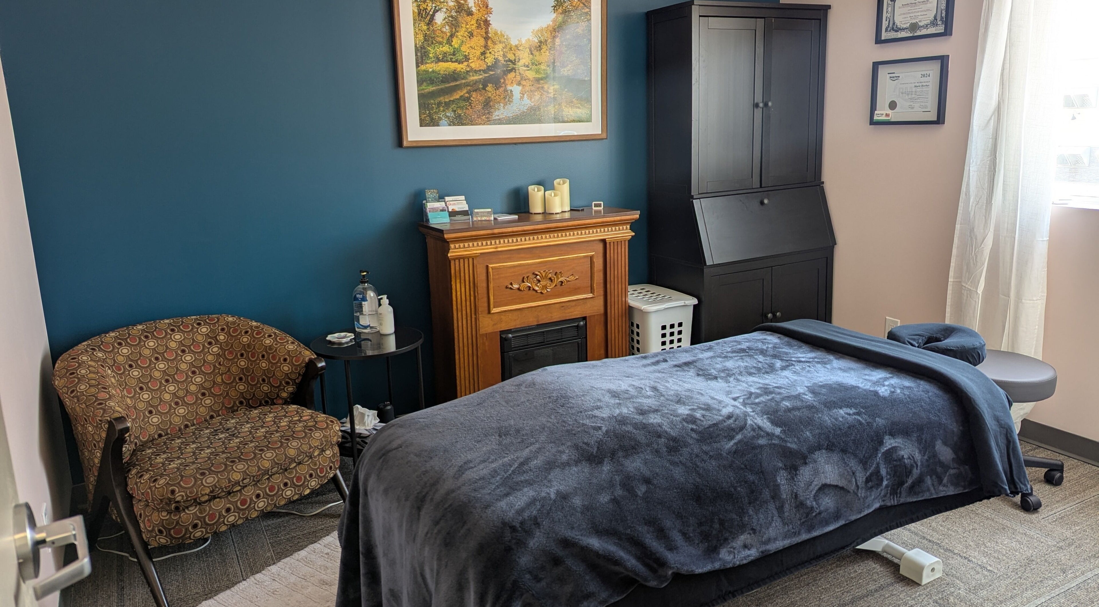 Elegant massage room at Marie Horbas RMT in West Saint Paul, Manitoba, CA with plush bed and decor.