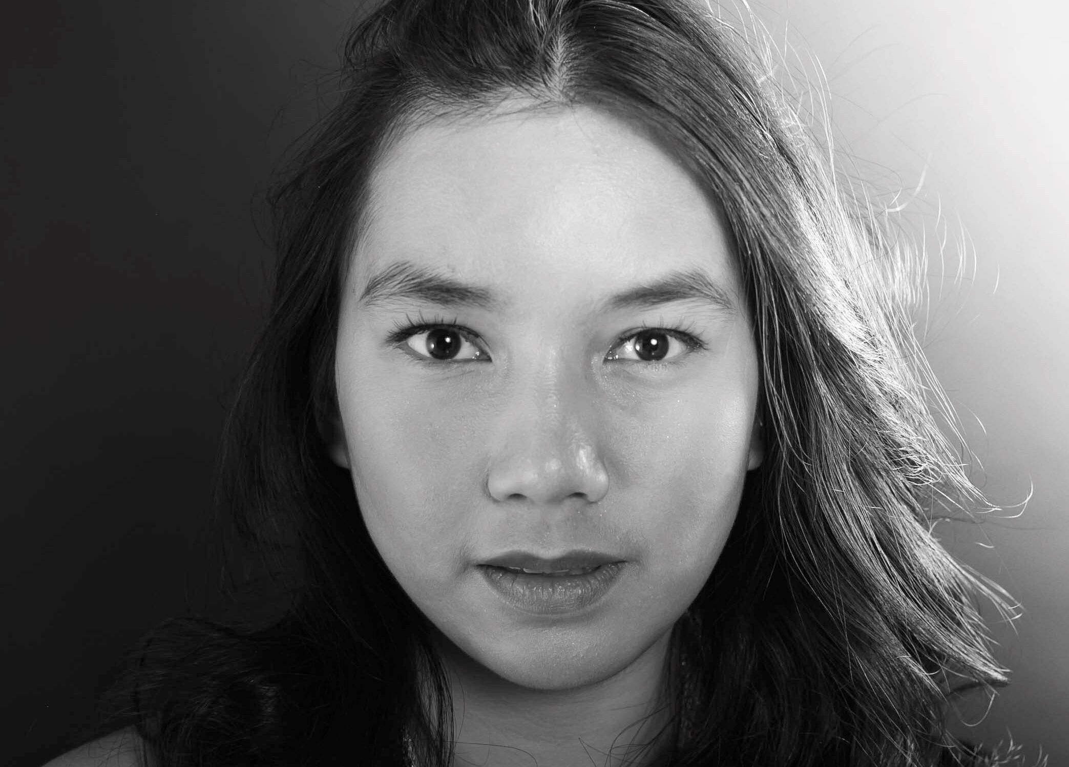 Portrait of woman with serene expression at Studio One YEG, Edmonton, Alberta, CA showcasing natural beauty.