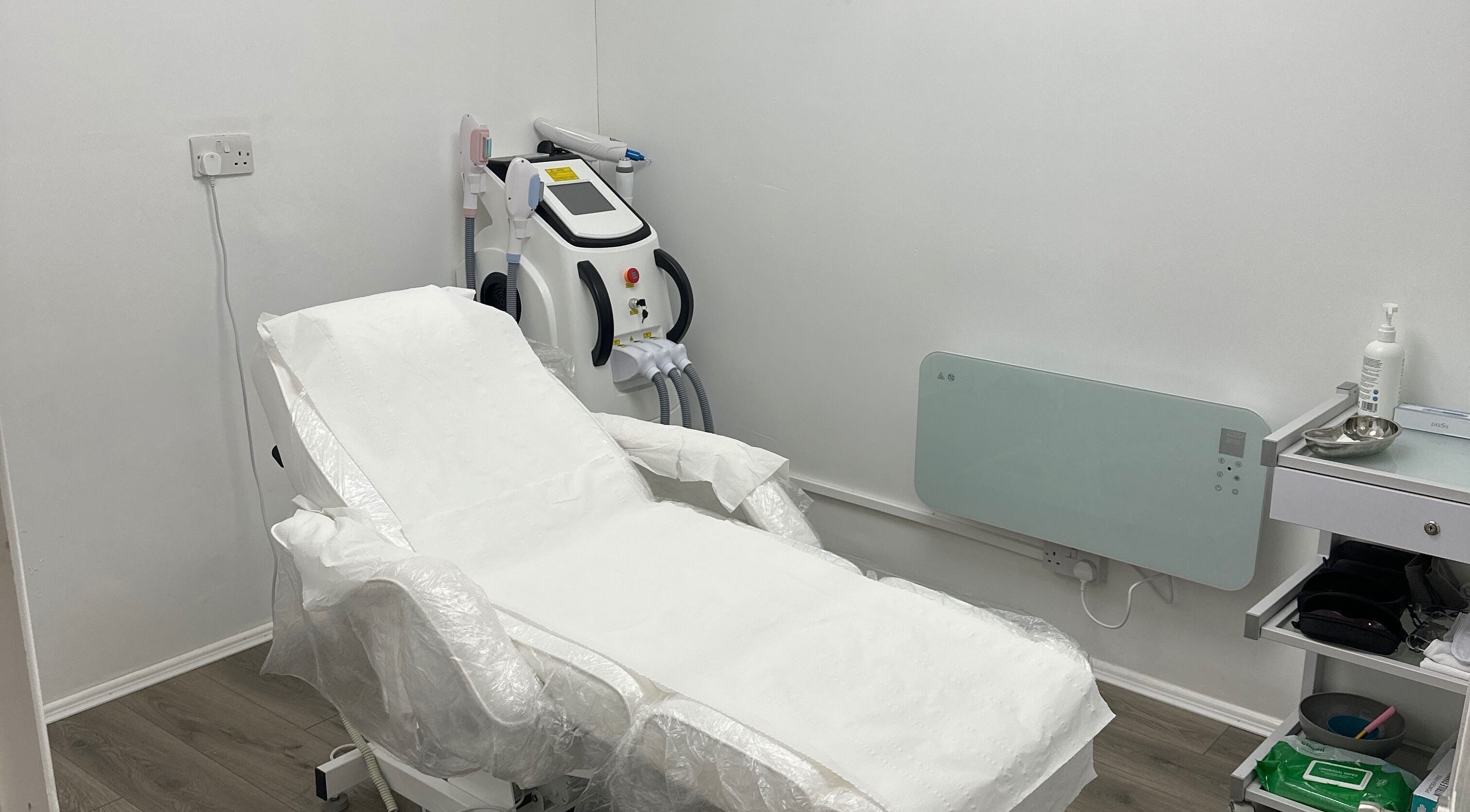 Modern treatment room at Home of Aesthetics and Beauty in Blackwood, Wales, GB, featuring advanced equipment.