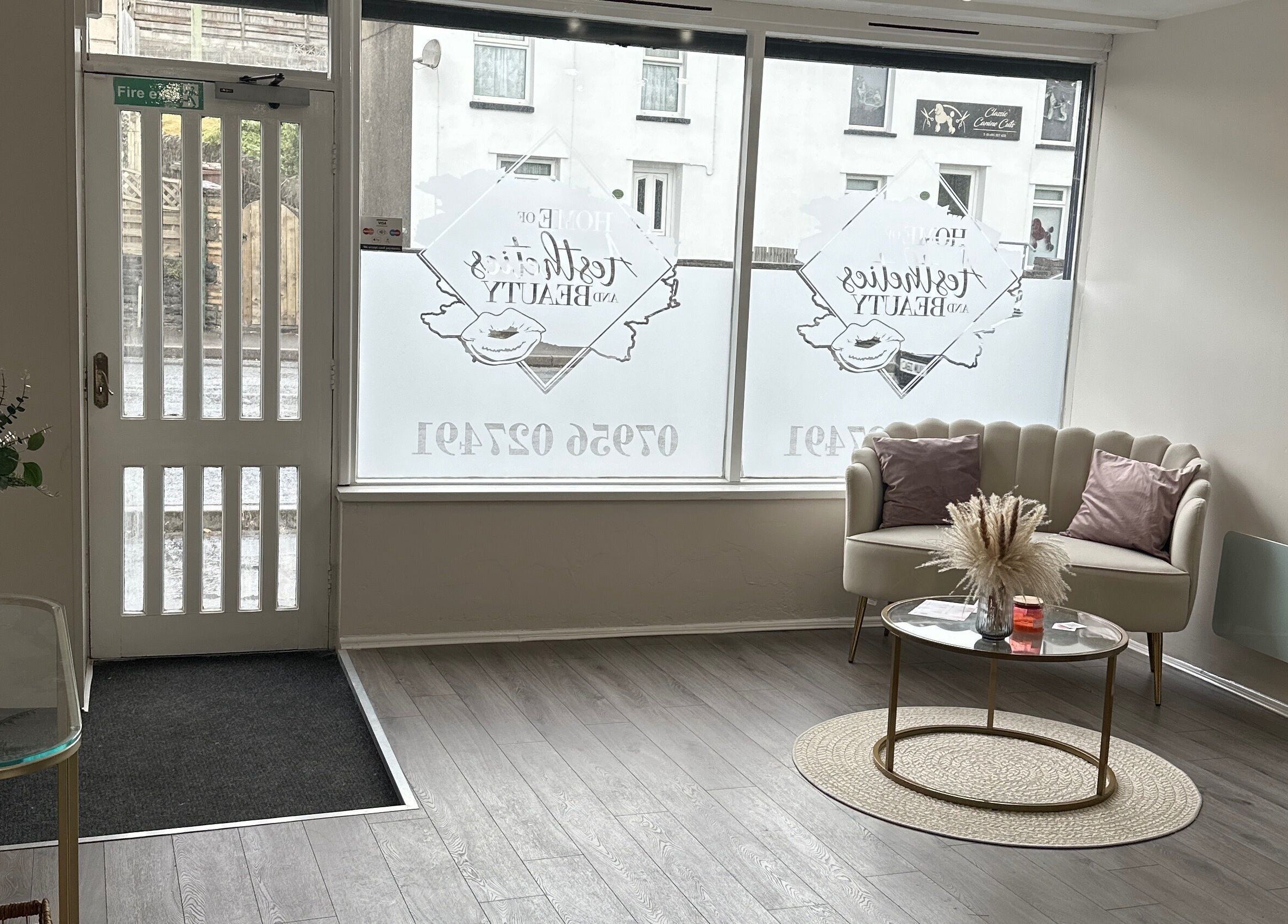 Inviting reception area at Home of Aesthetics and Beauty, Blackwood, Wales, GB with plush seating and decor.