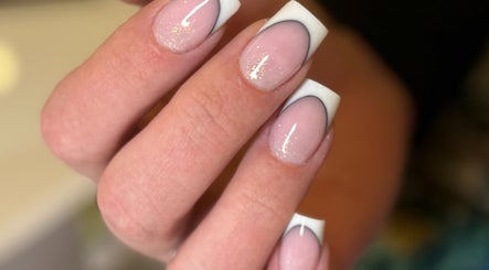 Stylish French manicure with glitter at Beauty Spot by Elena, North Bethesda, Maryland, US.