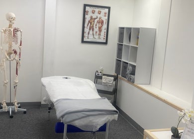 Relaxing treatment room at SJS Therapies, 1 Vigor Gym, Halifax, England, GB, featuring a massage table and decor.