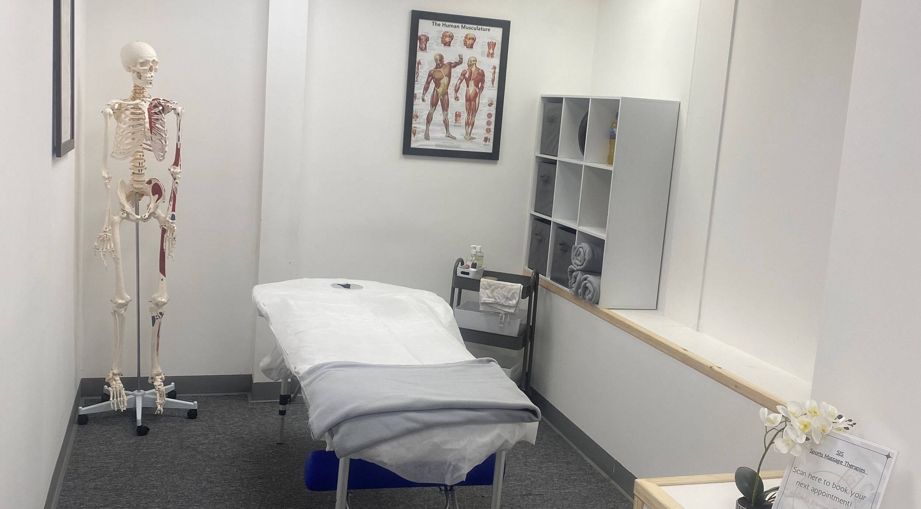 Relaxing treatment room at SJS Therapies, 1 Vigor Gym, Halifax, England, GB, featuring a massage table and decor.