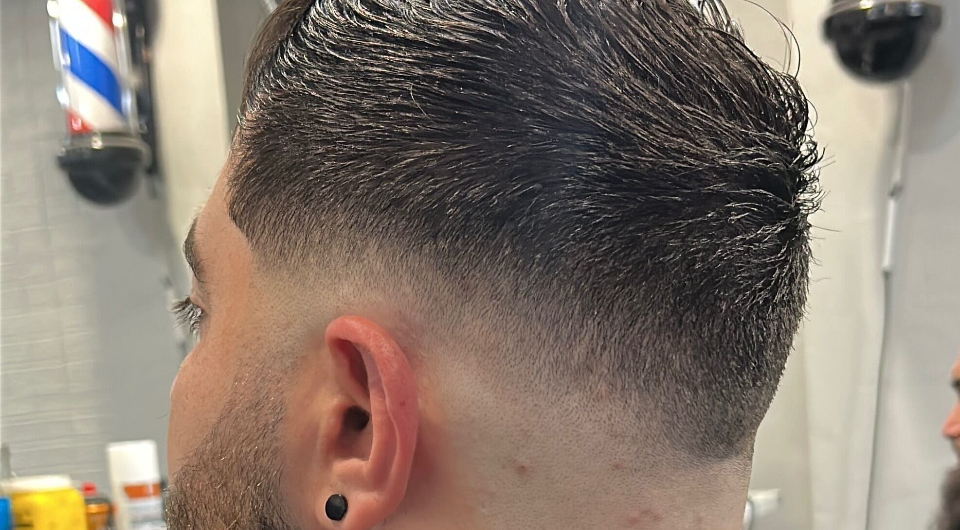 Close-up of a sharp fade haircut at Fade Arcade, Sydenham, New South Wales, AU showcasing expert styling.