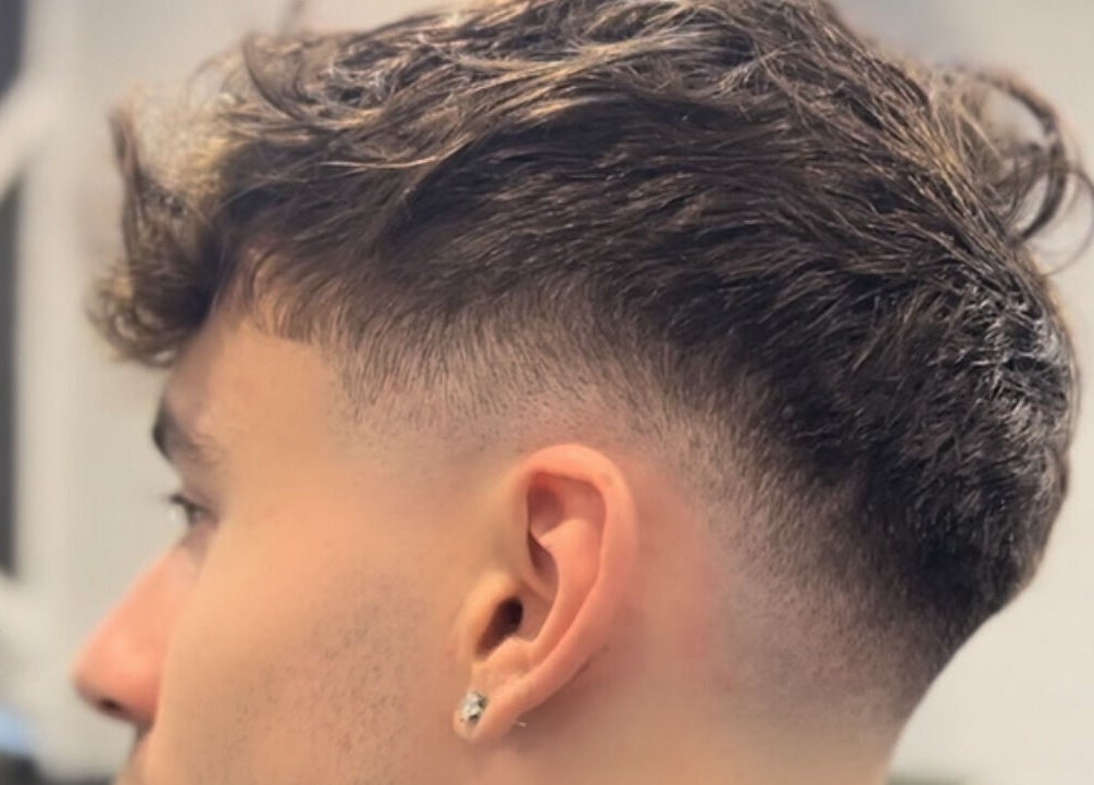 Trendy fade haircut at Fade Arcade, Sydenham, New South Wales, AU, showcasing precision styling.