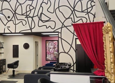 Interior of M. Curl at Tangles Salon with bold decor in Springfield, Missouri, US.