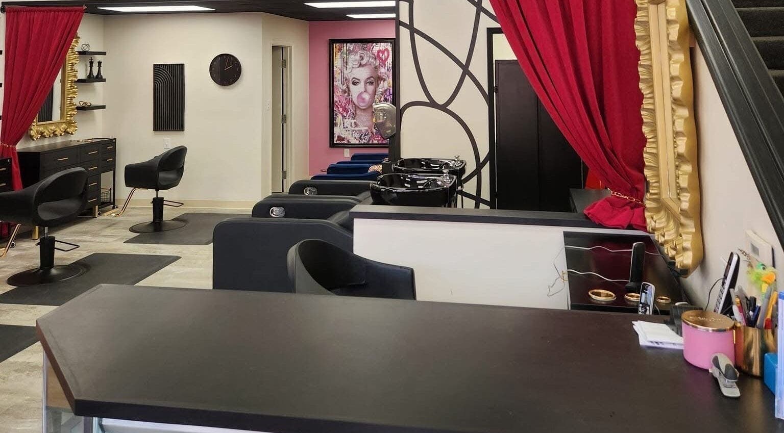 Inside M. Curl at Tangles Salon, Springfield, Missouri, US, featuring chic styling chairs and vibrant decor.
