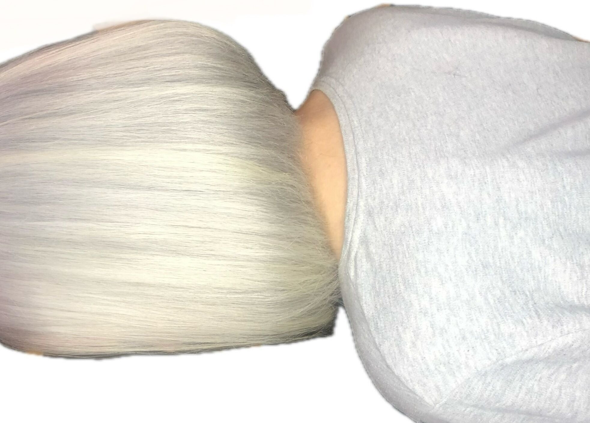 Sleek platinum bob hairstyle created at M. Curl at Tangles Salon in Springfield, Missouri, US.