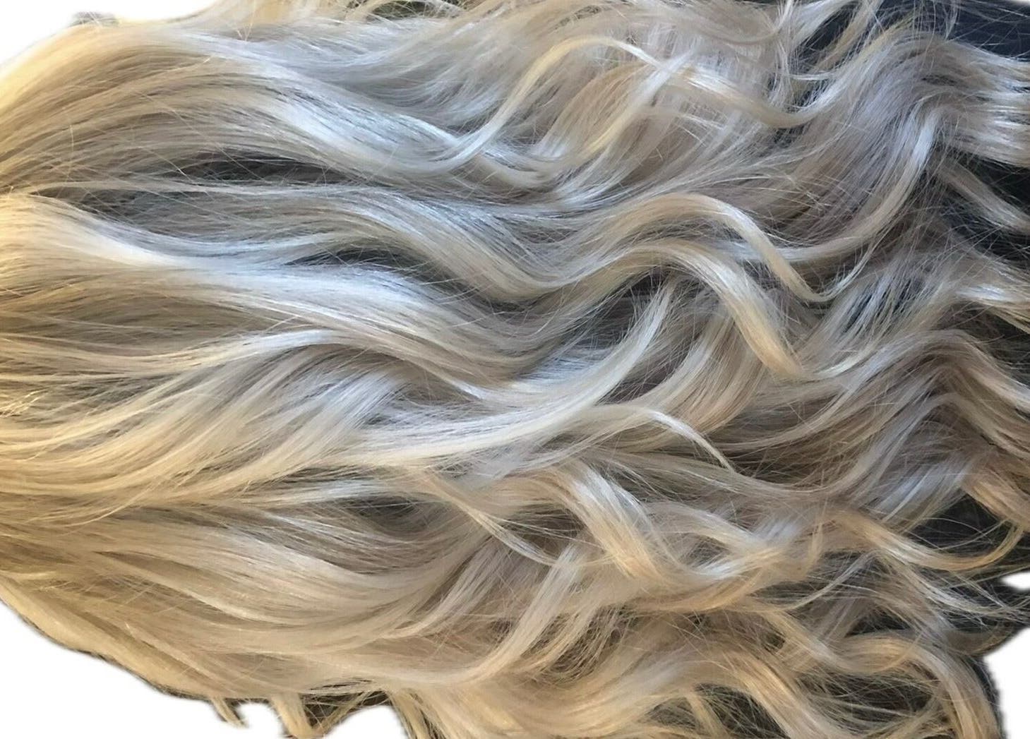 Beautiful platinum blonde curls styled by M. Curl at Tangles Salon, Springfield, Missouri, US.