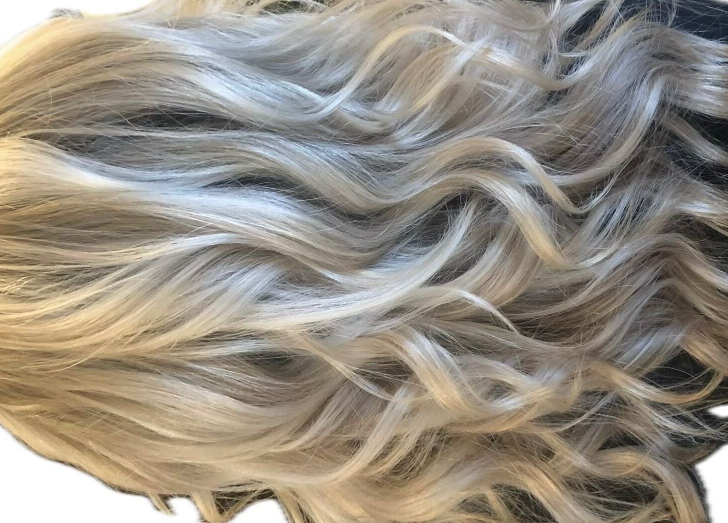 Beautiful platinum blonde curls styled by M. Curl at Tangles Salon, Springfield, Missouri, US.