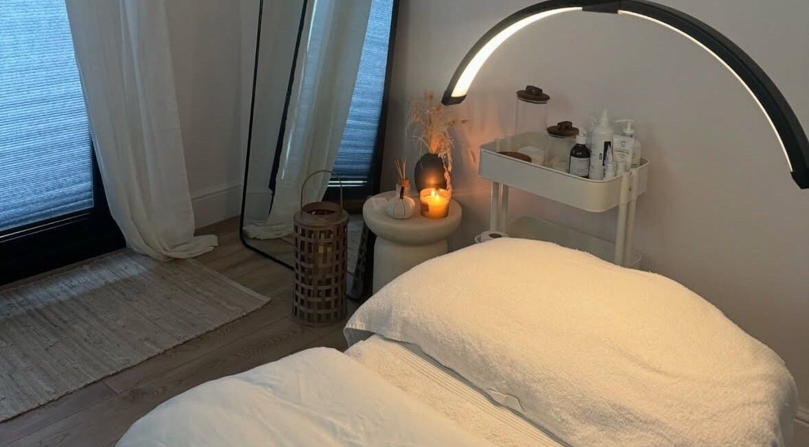 Soothing spa bed with candlelight at THE SKIN PROJECT, Warrington, England, GB. Relaxing ambiance for wellness.