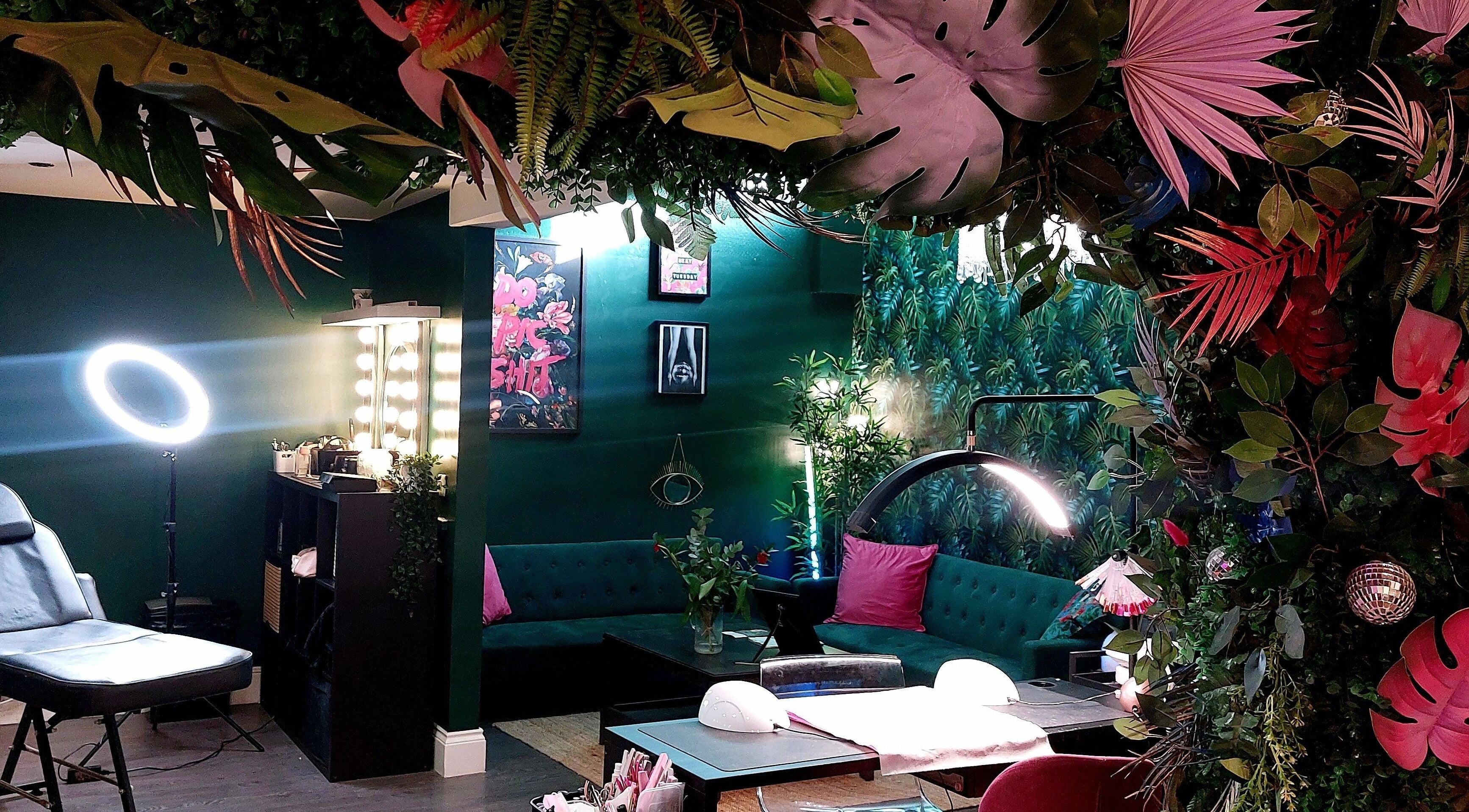 Lush interior of Shimmer your nails in Whitley Bay, England, GB featuring vibrant greenery and cozy seating.