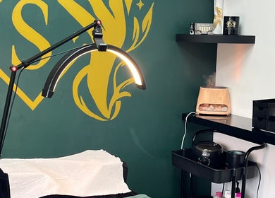 Modern treatment room at Beauty by Sarah in Llanharan, Wales, GB with a zen decor and elegant lighting.