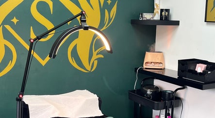 Cozy treatment room at Beauty by Sarah, Llanharan, Wales, GB, featuring a lighted magnifying lamp.