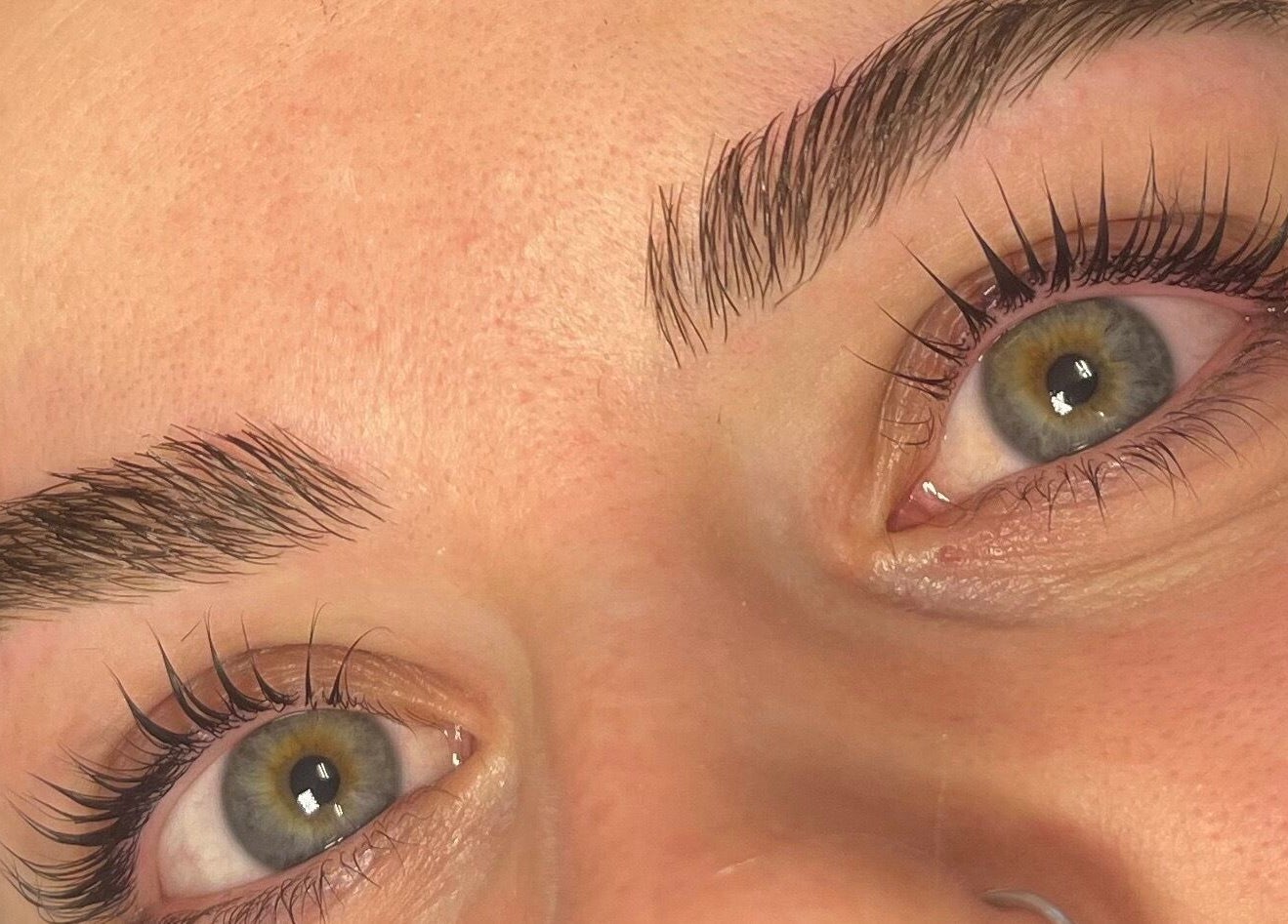 Close-up of expertly shaped eyebrows and long lashes at Beautybysarah, Coity, Wales, GB.
