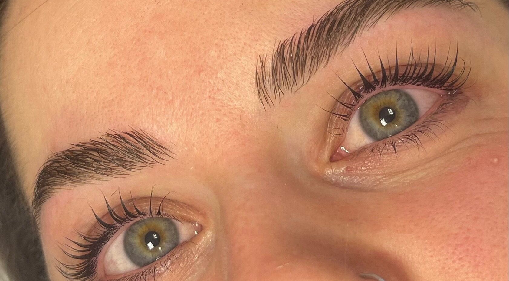 Close-up of expertly shaped eyebrows and long lashes at Beautybysarah, Coity, Wales, GB.