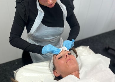 Facial treatment at Something About You, Bearpark, England, GB by a skilled professional wearing gloves.