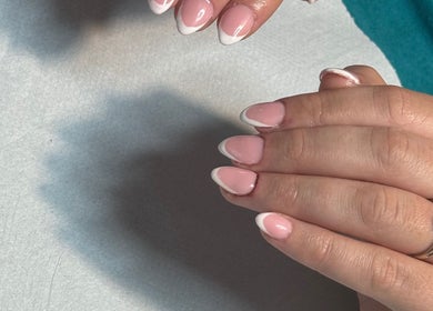 French manicure nails at Ashley @ The Beauty House, LEVEN, Scotland, GB, showcasing delicate pink and white tips.